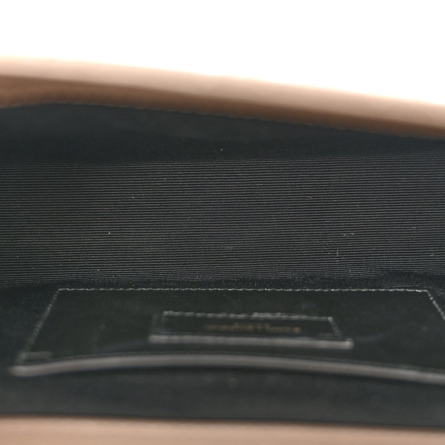 Textured satchel interior pocket with card slot, dark lining