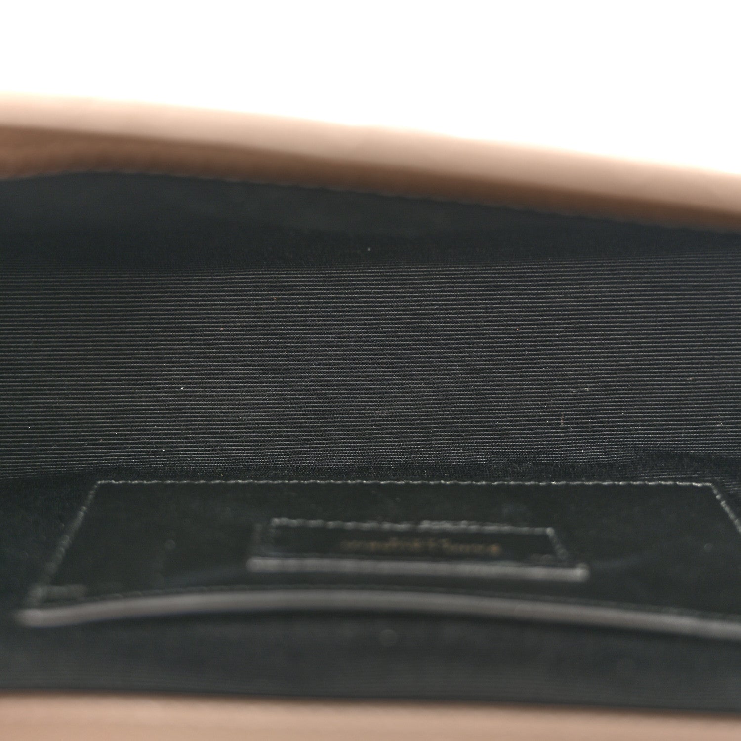 Textured satchel interior pocket with card slot, dark lining