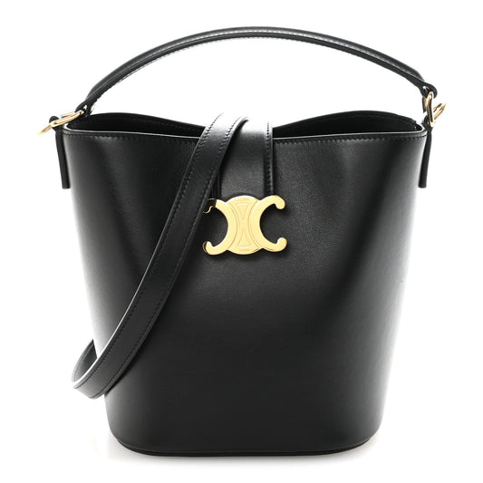 Small black Celine bucket bag with smooth finish, gold Triomphe logo, top handles