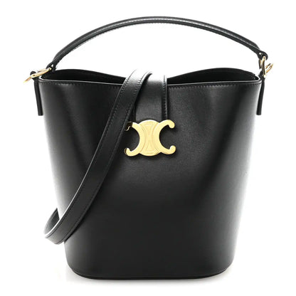 Small black Celine bucket bag with smooth finish, gold Triomphe logo, top handles