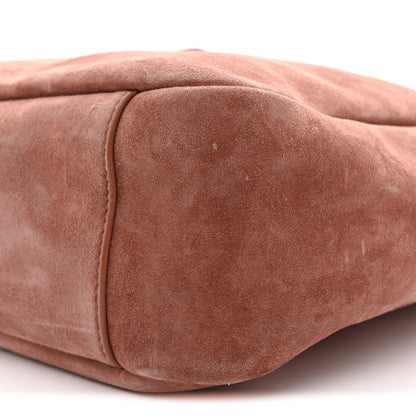 Small suede hobo bag close-up of end panel seam and textured suede surface