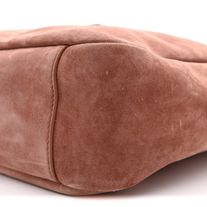 Small suede hobo bag close-up of end panel seam and textured suede surface