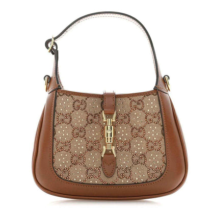 Mini hobo bag with tan leather trim, beige canvas GG monogram, top handle and gold hardware