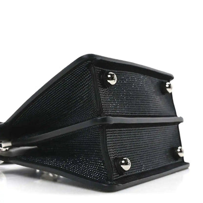 Black crystal satchel with leather back panel and hardware buttons