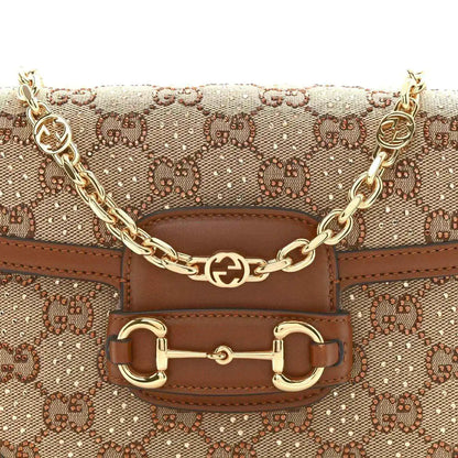 Mini shoulder bag front with GG monogram canvas, horsebit-style clasp, and gold chain