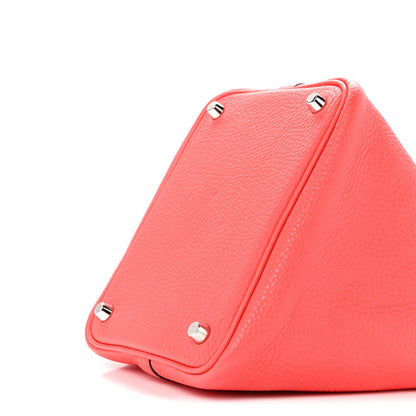 Rose pink leather tote bag corner view with round metal rivets