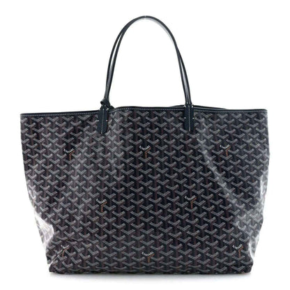 Navy Goyardine tote bag with repeating Goyard logo pattern and leather top handles.