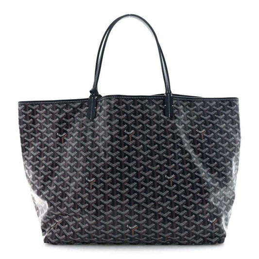 Navy Goyardine tote bag with repeating Goyard logo pattern and leather top handles.