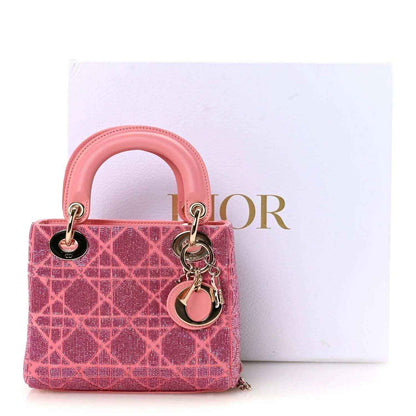 Mini Lady Dior handbag in light pink beaded pattern with top handles and charm keyring