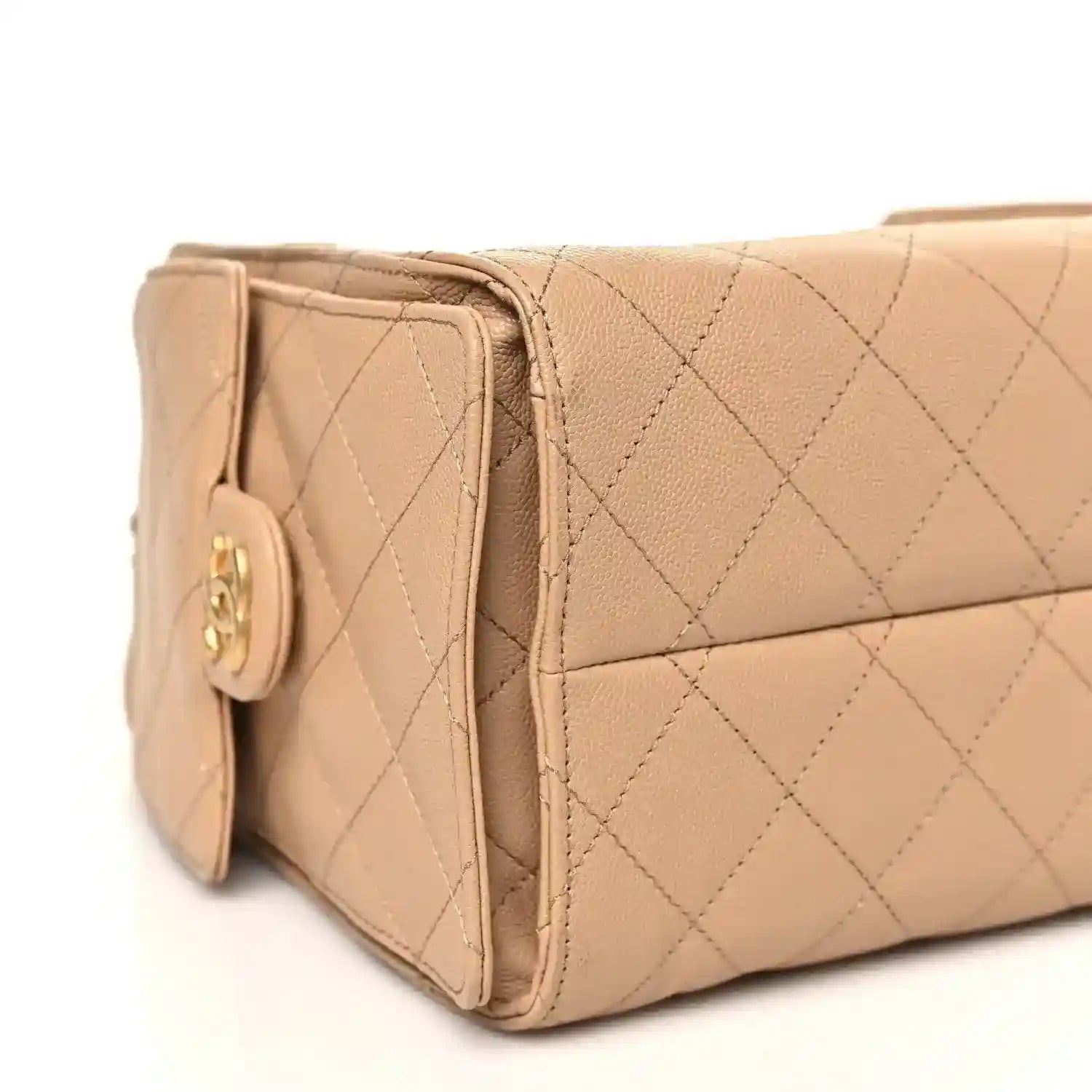 Chanel small 25 handbag side panel in dark beige with quilted texture and logo emblem