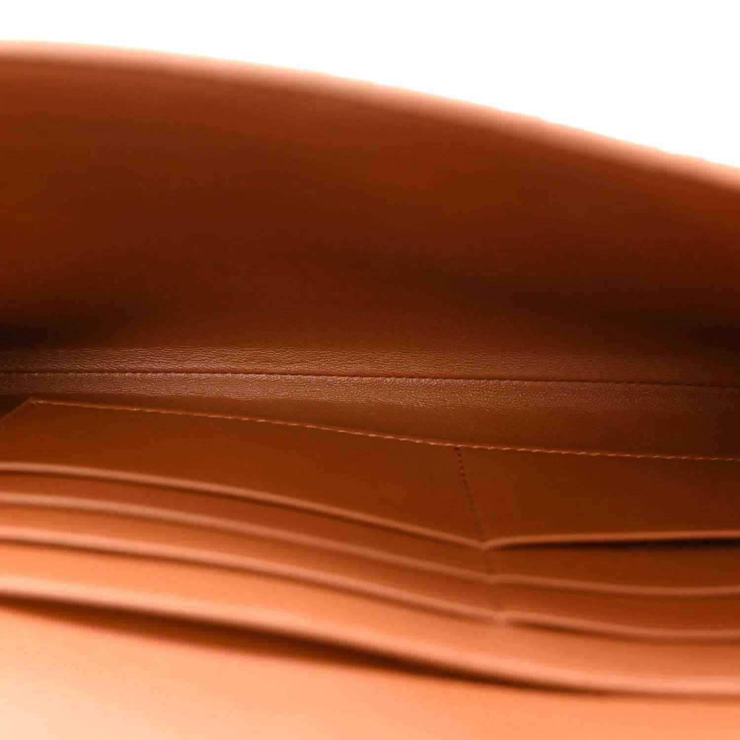 Brown suede clutch interior lining and seam detail