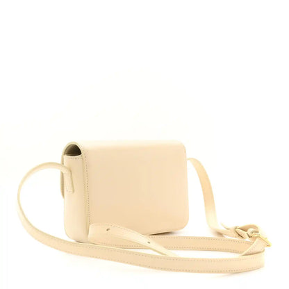 Nude calfskin shoulder bag with short strap, flap, and gold hardware