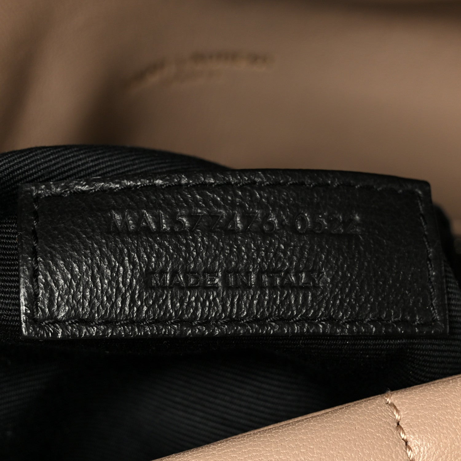 Small puffer chain satchel black label reading SAINT LAURENT PARIS