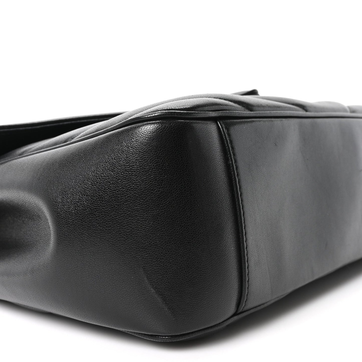 Black quilted lambskin shoulder bag side with rounded base