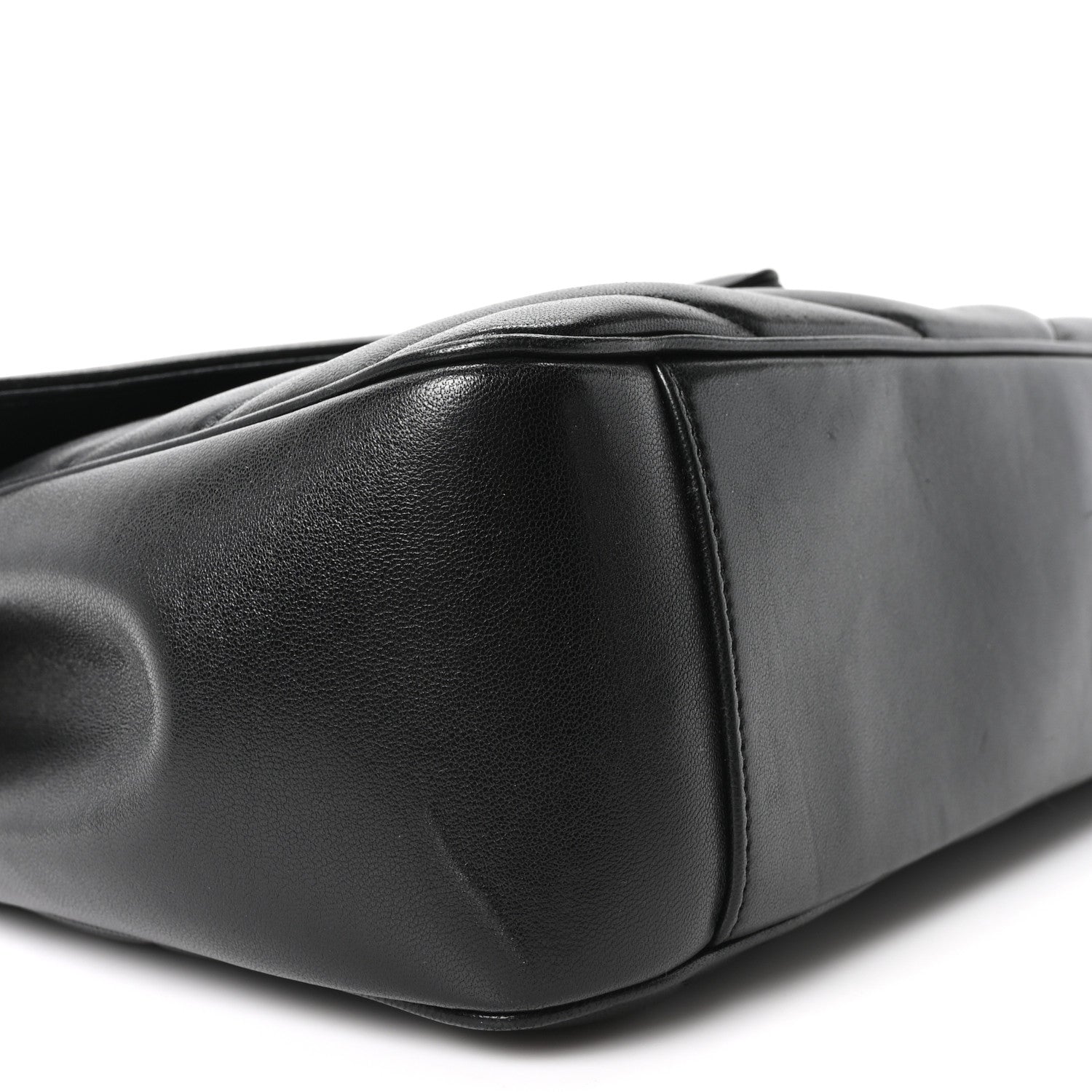 Black quilted lambskin shoulder bag side with rounded base