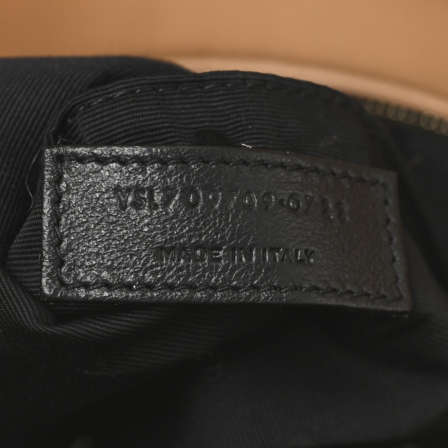 SAINT LAURENT leather label on black fabric lining inside shearling bag