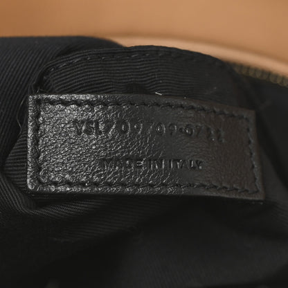 SAINT LAURENT leather label on black fabric lining inside shearling bag