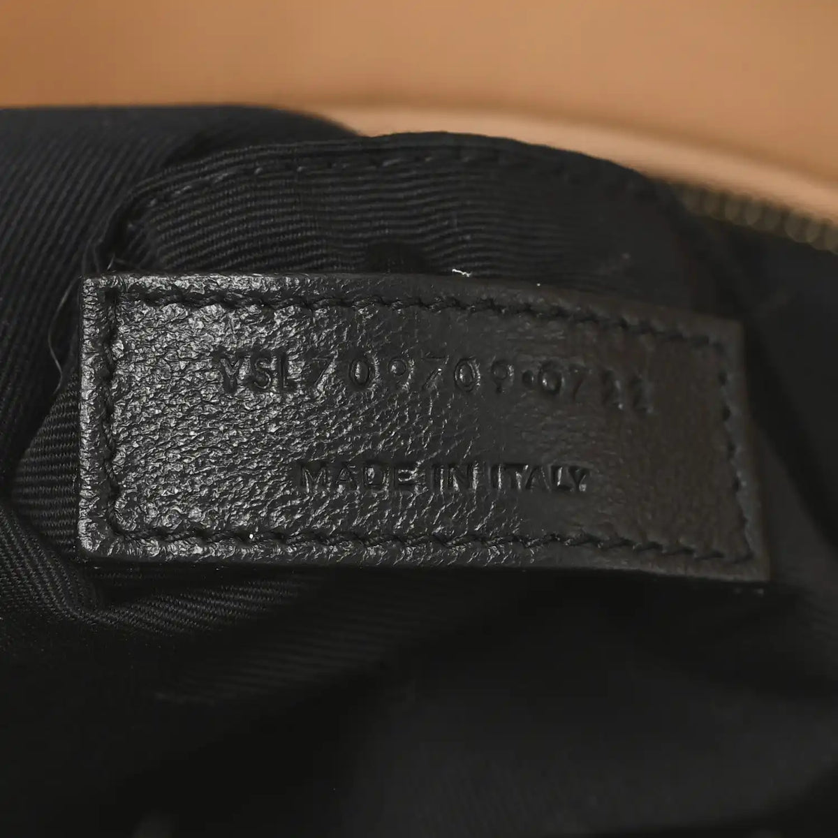 SAINT LAURENT leather label on black fabric lining inside shearling bag