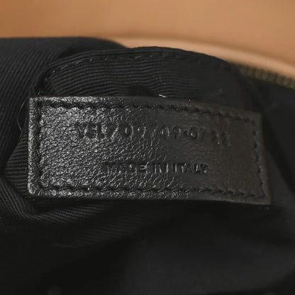 SAINT LAURENT leather label on black fabric lining inside shearling bag