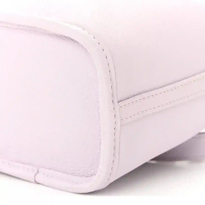 Lilac BB bag side panel with curved seam and stitched leather trim