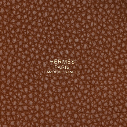 Leather lining close-up with embossed text and brown pebbled texture