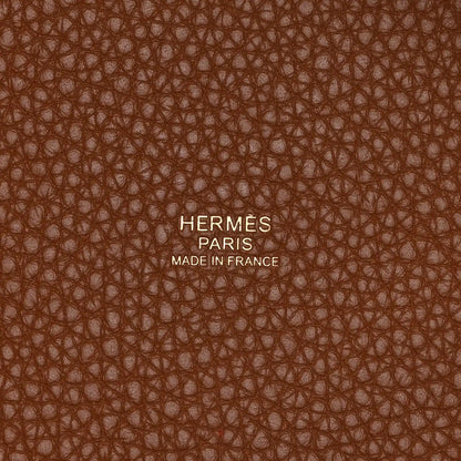Leather lining close-up with embossed text and brown pebbled texture