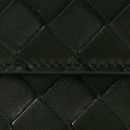 Close-up of black intrecciato woven leather clutch pattern