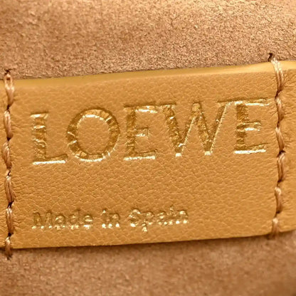 Tan leather clutch flap with LOEWE embossed logo and contrast stitching