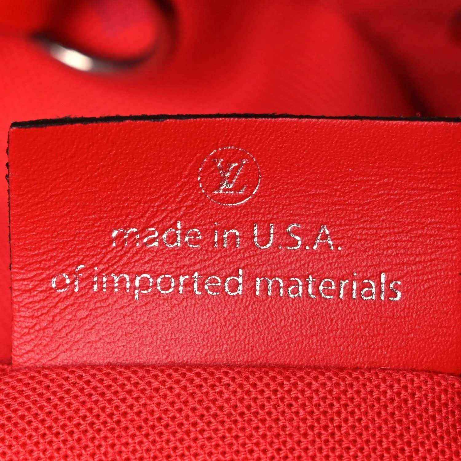Red leather tag reading "made in U.S.A." on Louis Vuitton tote