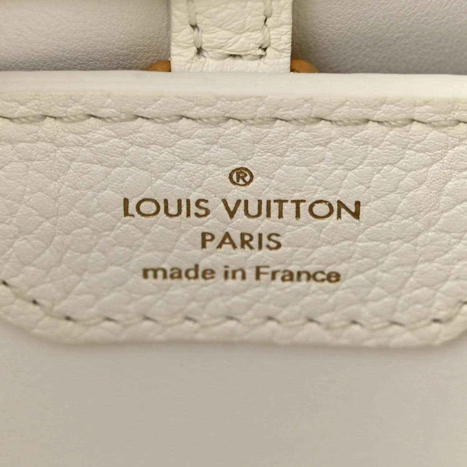 White leather bag label with Louis Vuitton Paris and made in France stamp
