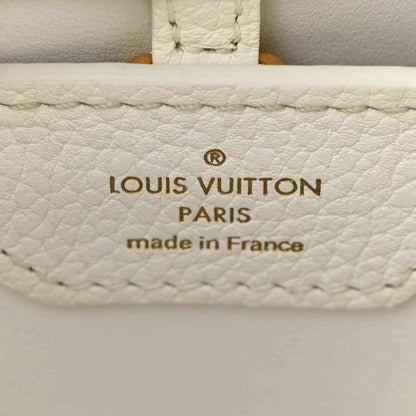 White leather bag label with Louis Vuitton Paris and made in France stamp