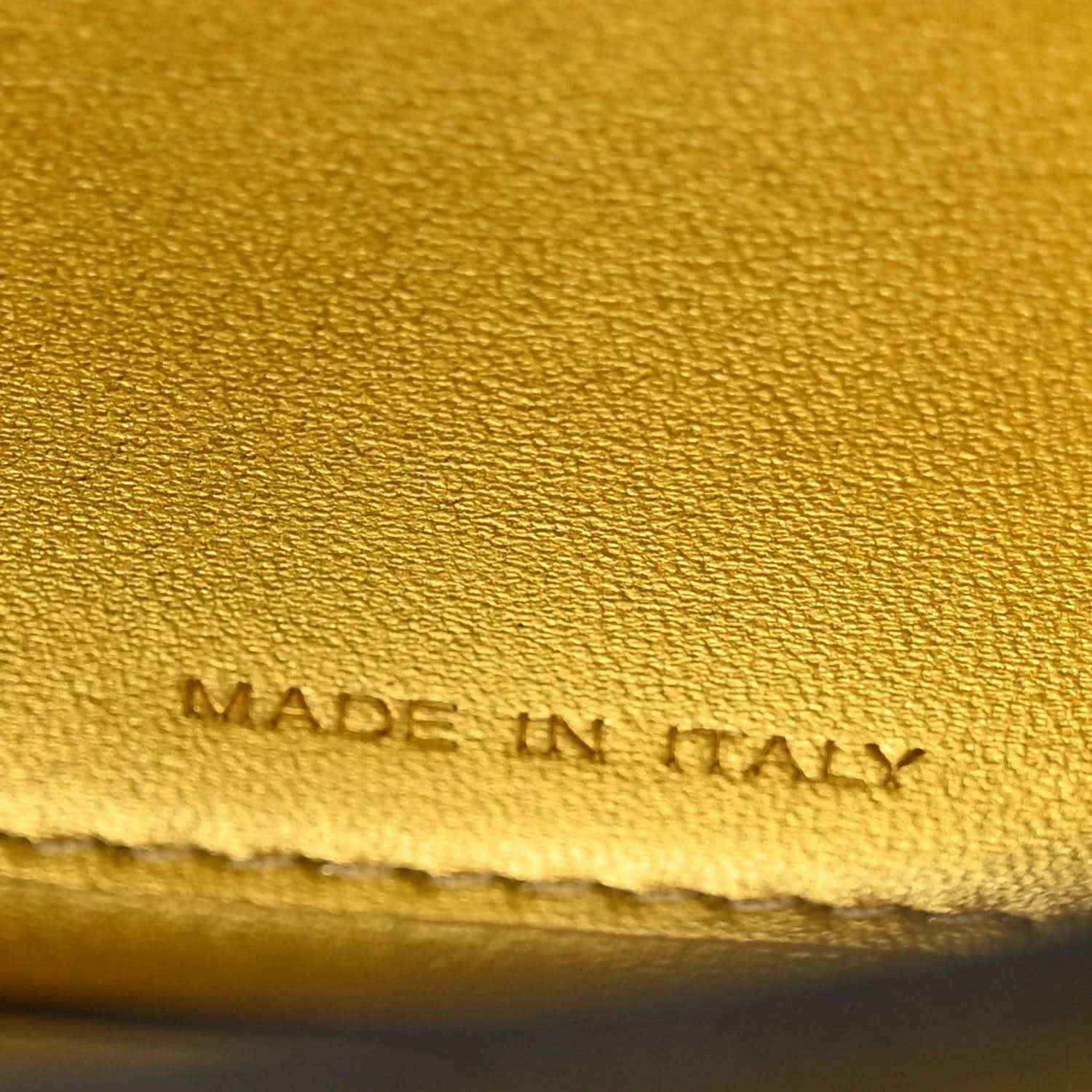 Gold leather lining with “MADE IN ITALY” stamped text and stitched border