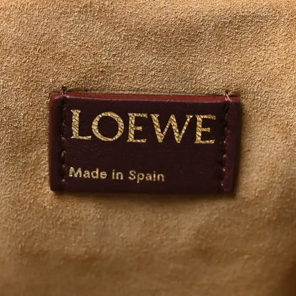 Loewe leather clutch label with “Made in Spain” text