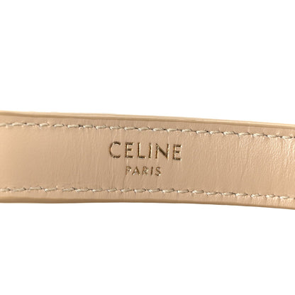 Celine Paris logo on beige leather strap with contrast stitching