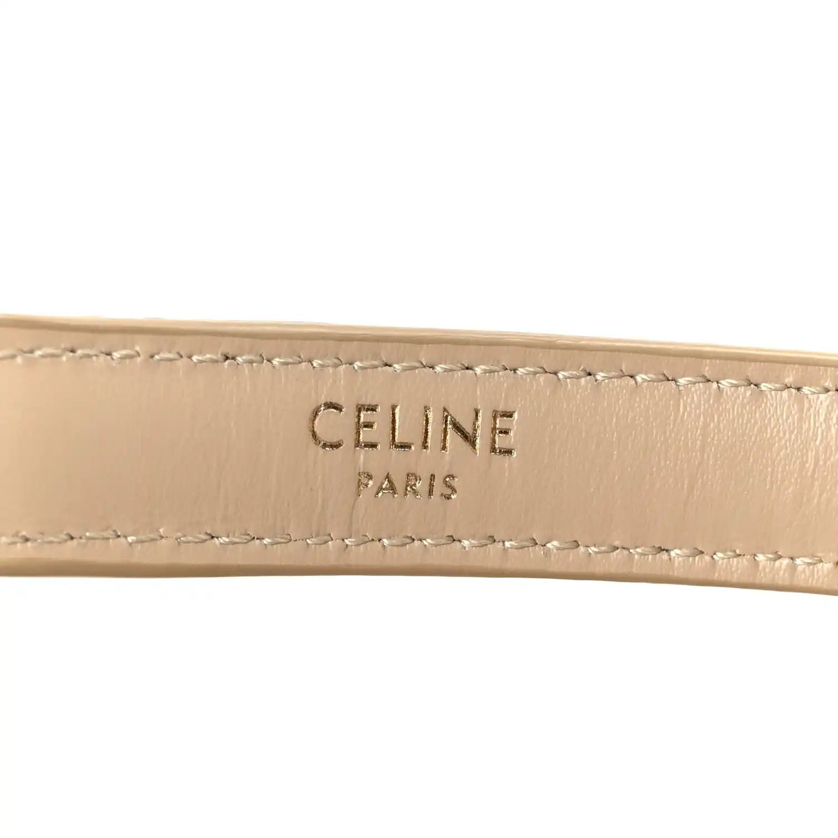 Celine Paris logo on beige leather strap with contrast stitching