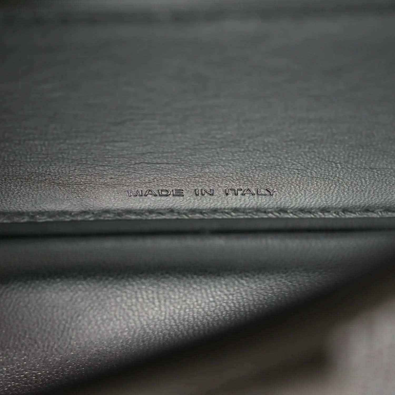 Dark leather base with embossed 'MADE IN ITALY' text