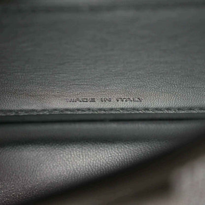 Dark leather base with embossed 'MADE IN ITALY' text