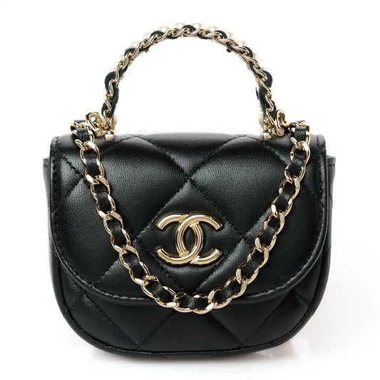 Black quilted leather clutch with gold CC emblem and linked shoulder chain