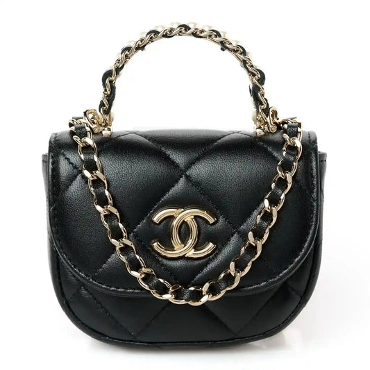 Black quilted leather clutch with gold CC emblem and linked shoulder chain