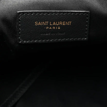 Black leather brand patch reading SAINT LAURENT PARIS on tote lining.