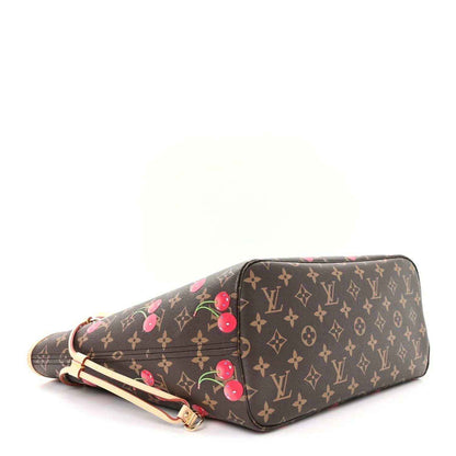 Cherry-print monogram tote bag, angled view showing base and front edge.