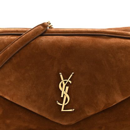 Saint Laurent suede shoulder bag flap in caramel cognac with gold YSL logo.