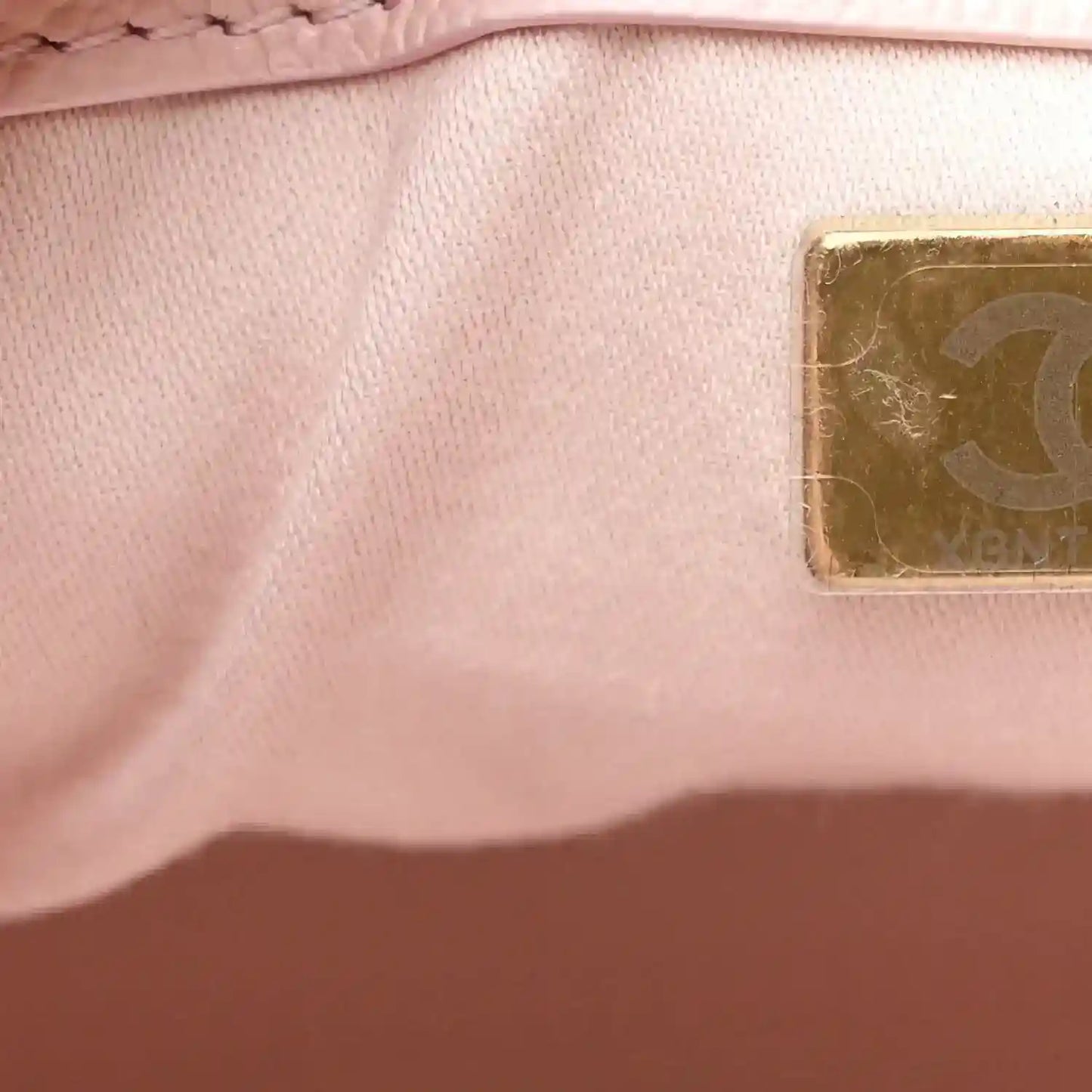 Chanel light pink caviar leather interior lining with embossed stamp