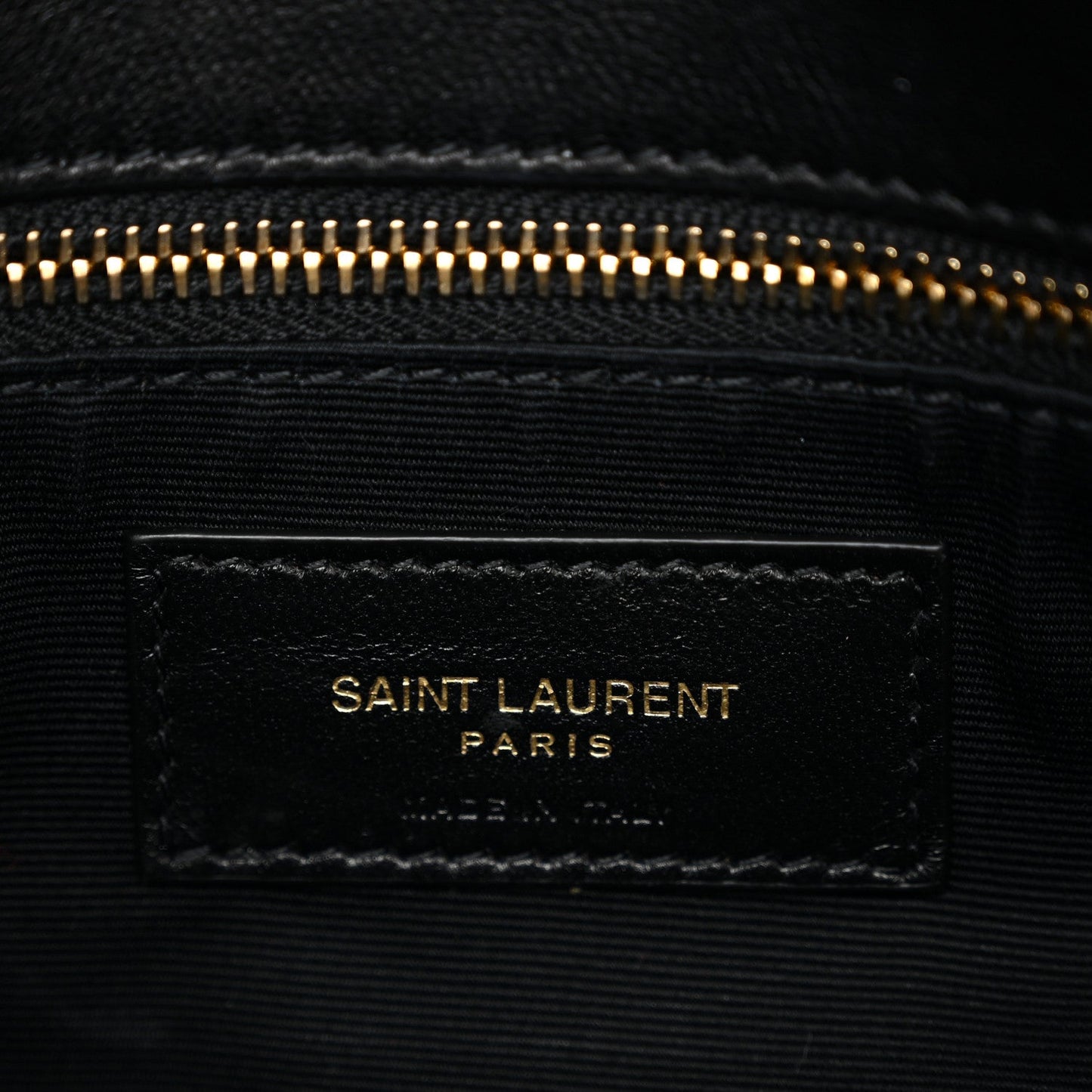 Saint Laurent Paris leather label on interior lining with gold-tone zipper