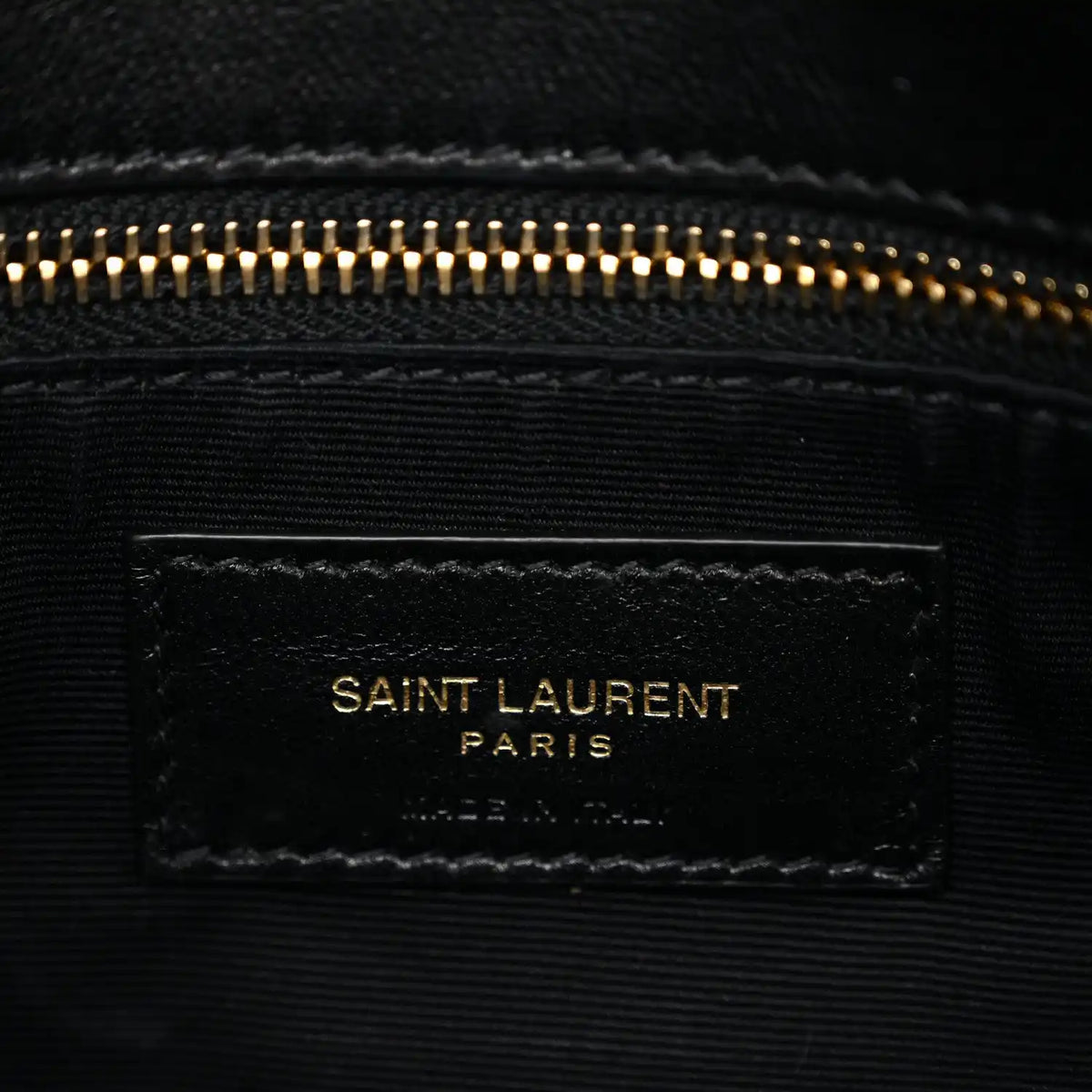 Saint Laurent Paris leather label on interior lining with gold-tone zipper