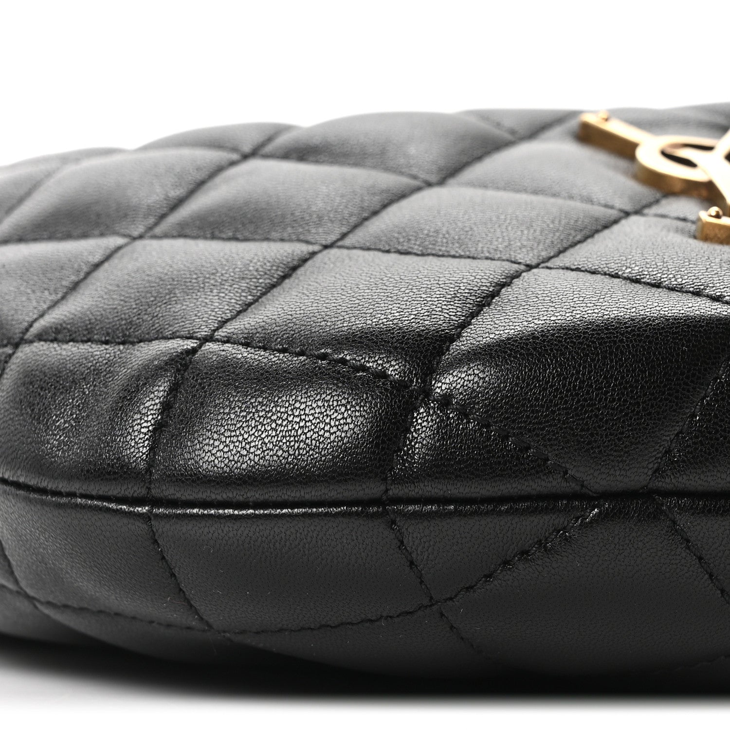 Quilted black leather bag with stitched diamond pattern