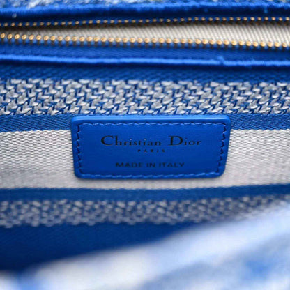 Dior logo patch reading 'Made in Italy' on blue lining of tote bag