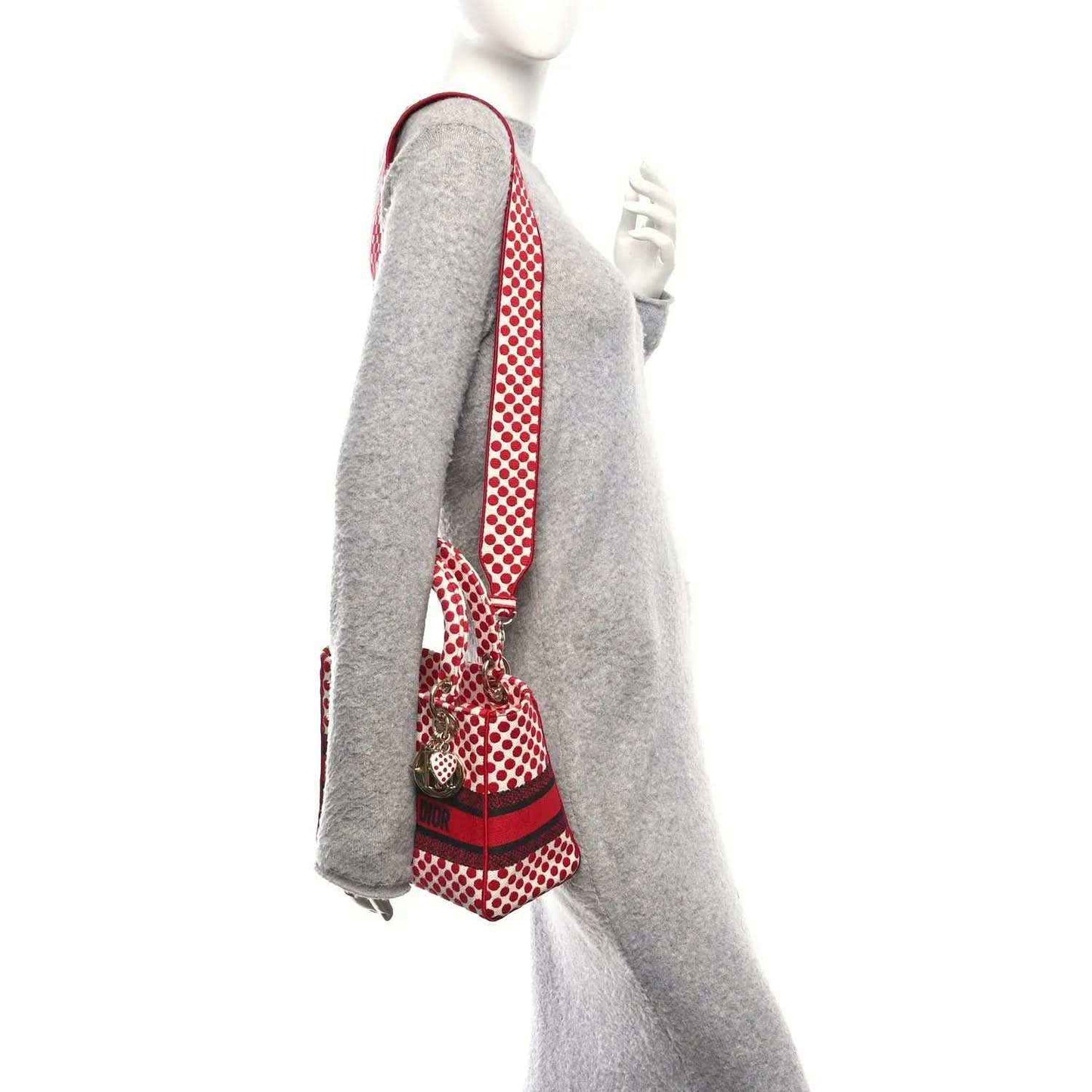Red and white polka dot canvas bag with shoulder strap and red center band
