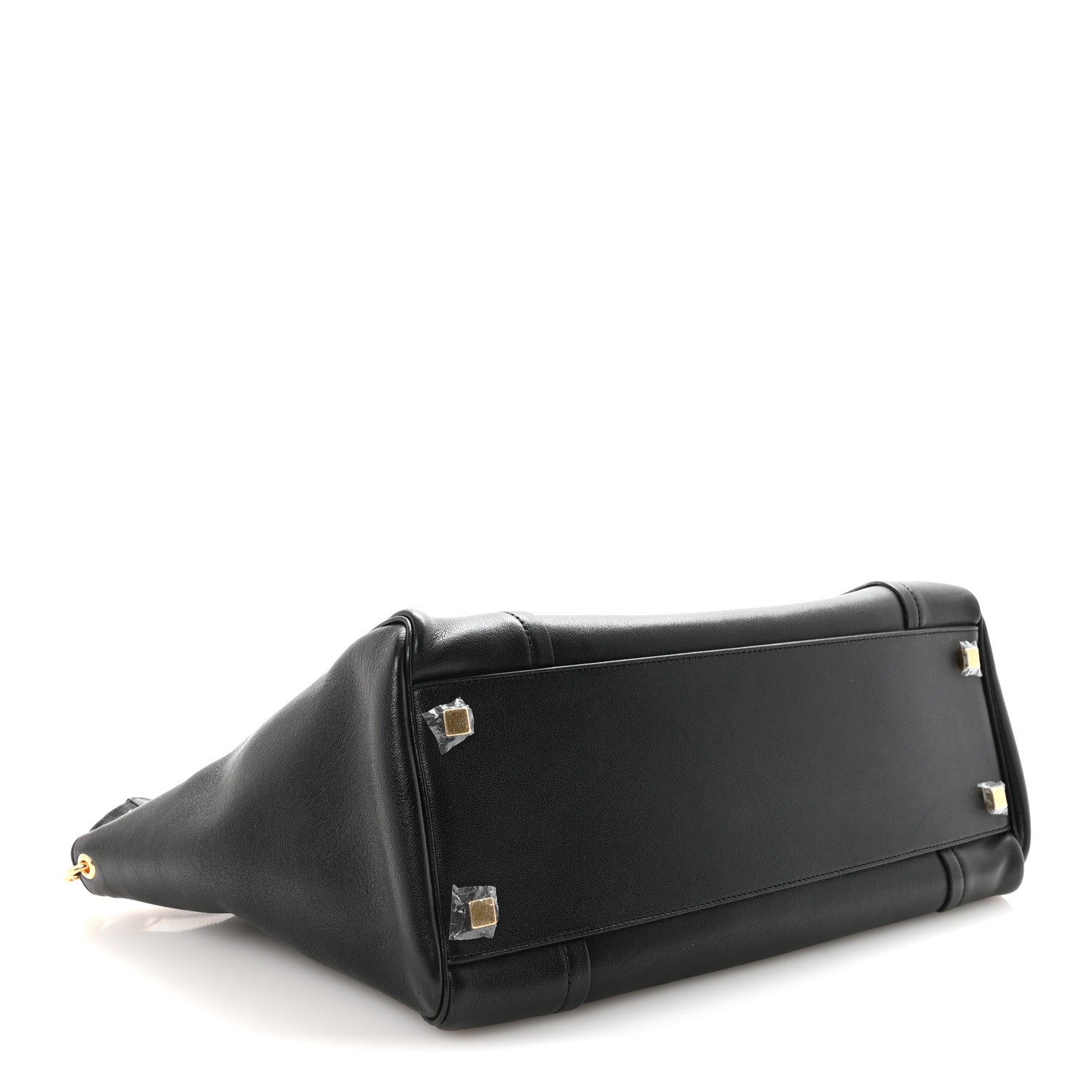Black leather luggage bag with structured sides and gold-tone hardware.