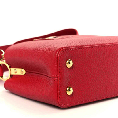 Louis Vuitton scarlet leather mini handbag side view with gold-tone corner hardware